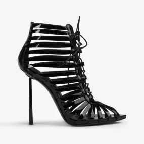 CAGE ANKLE BOOT 120 mm Black patent leather gladiator ankle boot with straps